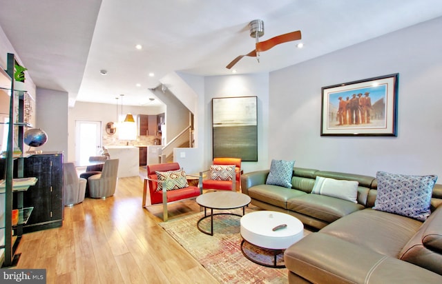 living room with recessed lighting, light wood-style flooring, and ceiling fan