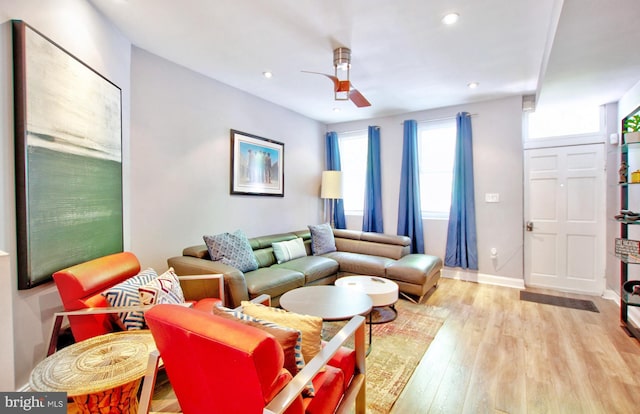 living area featuring baseboards, recessed lighting, a ceiling fan, and wood finished floors