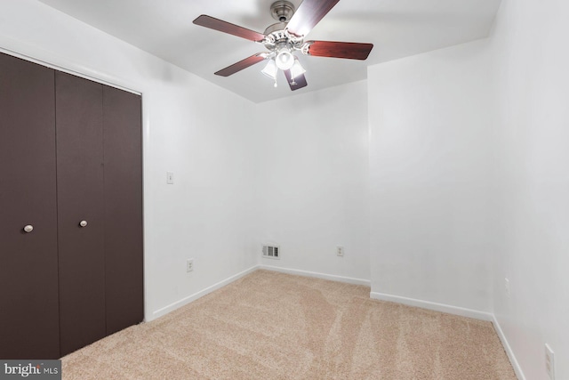 3403 Toone St, Baltimore, MD 21224 - unfurnished bedroom featuring light carpet, baseboards, a closet, and ceiling fan