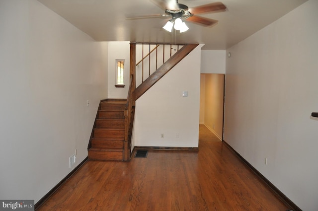 3403 Toone St, Baltimore, MD 21224 - unfurnished living room featuring ceiling fan, stairs, wood finished floors, and baseboards