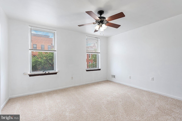 3403 Toone St, Baltimore, MD 21224 - carpeted spare room featuring baseboards and ceiling fan