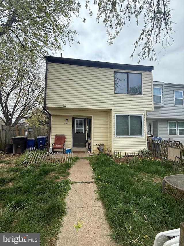 back of house featuring fence