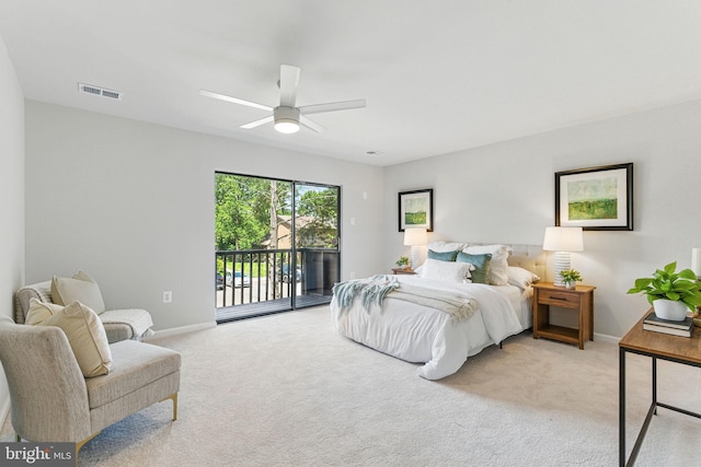 bedroom featuring access to exterior, light colored carpet, and baseboards