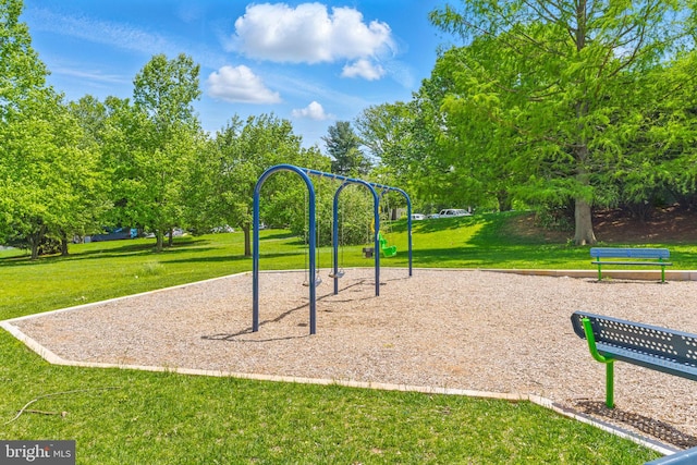 communal playground featuring a yard