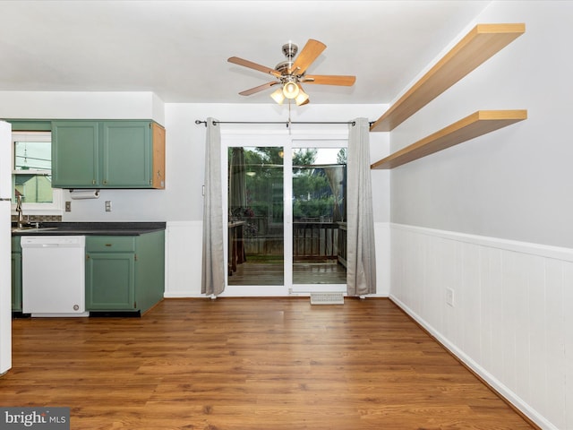 201 N 2nd St, Woodsboro, MD 21798 - kitchen featuring green cabinetry, dishwasher, a ceiling fan, dark countertops, and wood finished floors