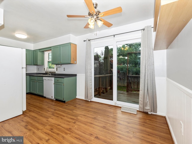 201 N 2nd St, Woodsboro, MD 21798 - kitchen featuring green cabinets, white appliances, dark countertops, ceiling fan, and light wood-type flooring