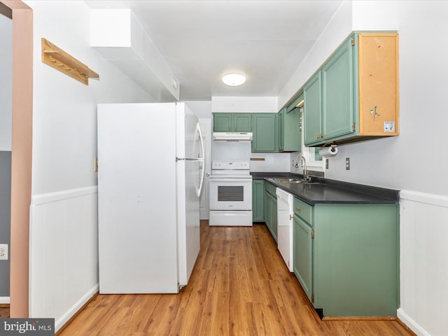 201 N 2nd St, Woodsboro, MD 21798 - kitchen featuring white appliances, green cabinetry, under cabinet range hood, a sink, and light wood-style floors