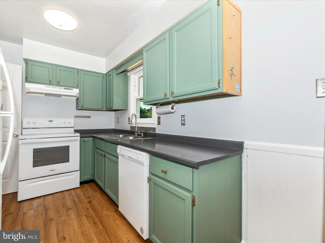 201 N 2nd St, Woodsboro, MD 21798 - kitchen featuring white appliances, a sink, under cabinet range hood, dark countertops, and green cabinetry