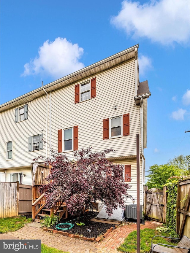 201 N 2nd St, Woodsboro, MD 21798 - rear view of house with central AC unit and a fenced backyard