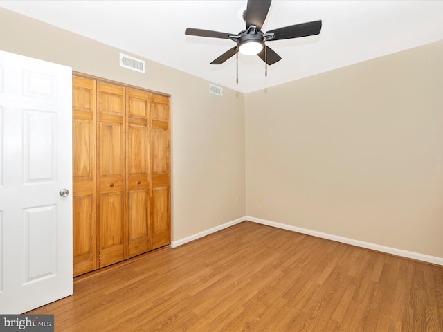 201 N 2nd St, Woodsboro, MD 21798 - unfurnished bedroom featuring light wood-style flooring, baseboards, a closet, and a ceiling fan