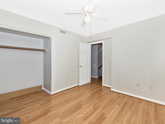 201 N 2nd St, Woodsboro, MD 21798 - unfurnished bedroom with light wood-style flooring, baseboards, a closet, and a ceiling fan