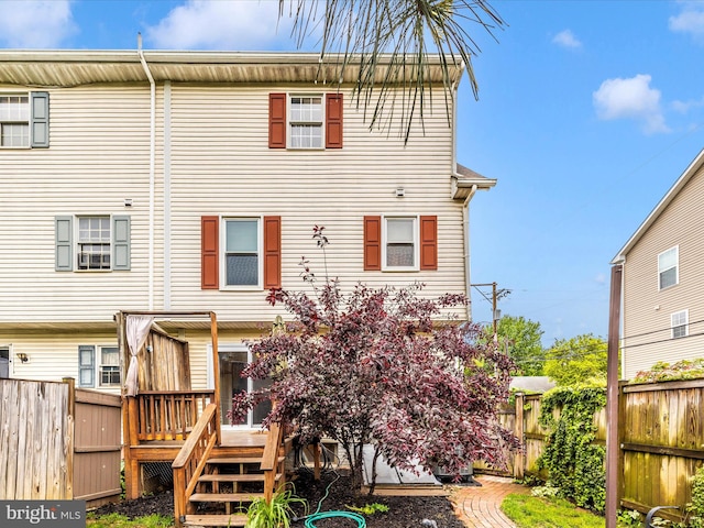 201 N 2nd St, Woodsboro, MD 21798 - back of house with a wooden deck and a fenced backyard
