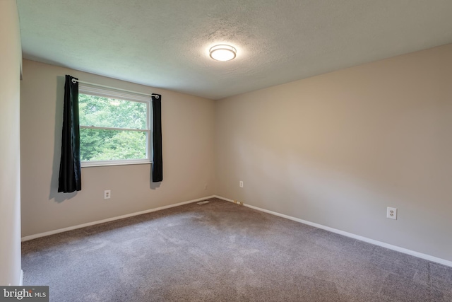 15926 Uppsala Ct, Woodbridge, VA 22191 - unfurnished room featuring carpet flooring, a textured ceiling, and baseboards