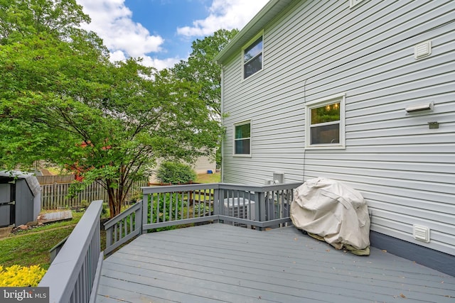 15926 Uppsala Ct, Woodbridge, VA 22191 - wooden terrace featuring fence, a shed, an outdoor structure, and area for grilling