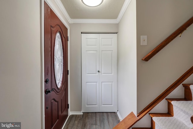 15926 Uppsala Ct, Woodbridge, VA 22191 - foyer featuring wood finished floors, crown molding, stairway, and baseboards