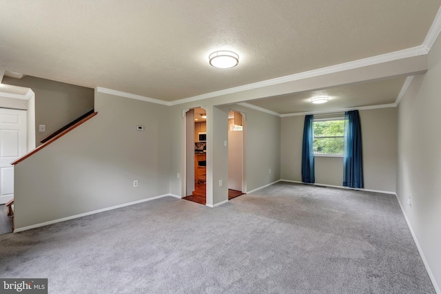 15926 Uppsala Ct, Woodbridge, VA 22191 - spare room featuring crown molding, baseboards, carpet floors, stairs, and a textured ceiling