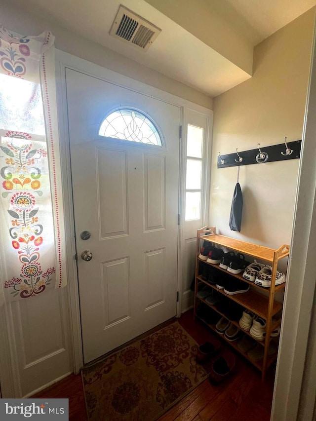 entrance foyer with visible vents and wood finished floors