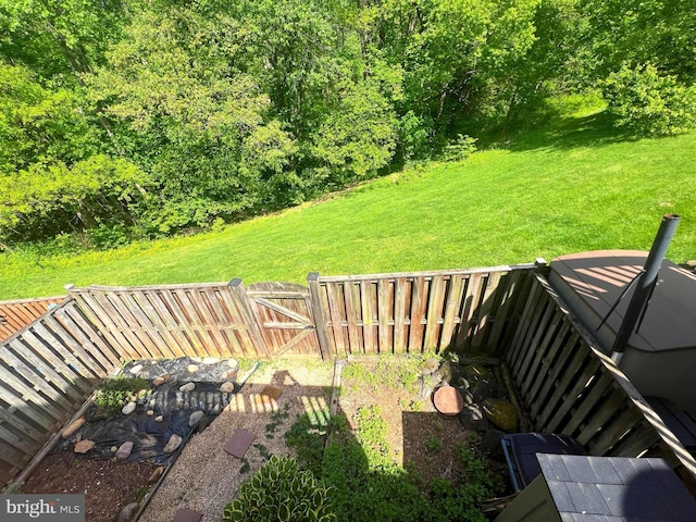 view of yard with a fenced backyard