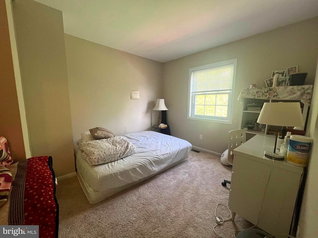 carpeted bedroom with baseboards