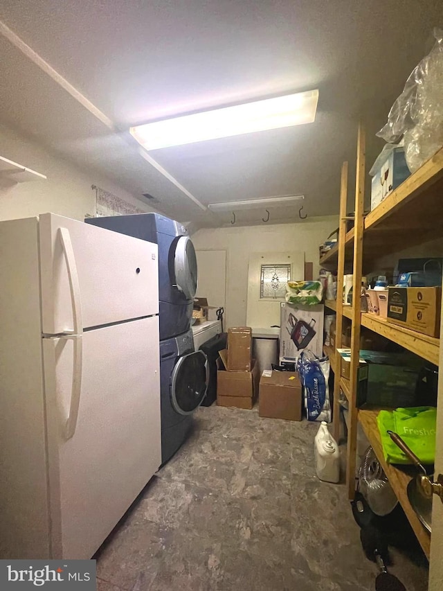 interior space featuring stacked washer / drying machine