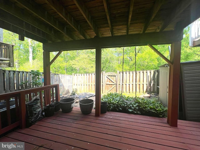 wooden deck featuring a fenced backyard