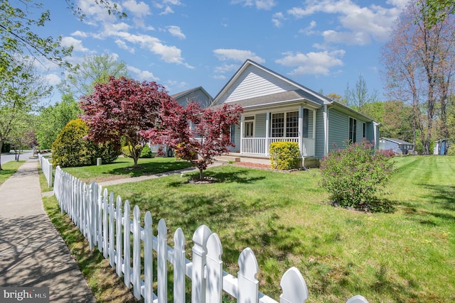 view of home's exterior with a porch, a yard, and fence