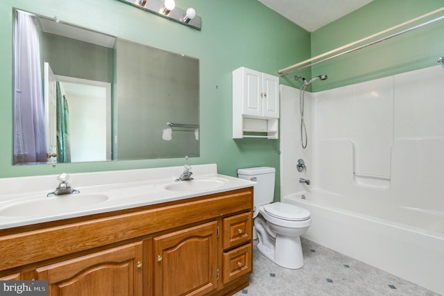 bathroom with double vanity, toilet, shower / tub combination, and a sink