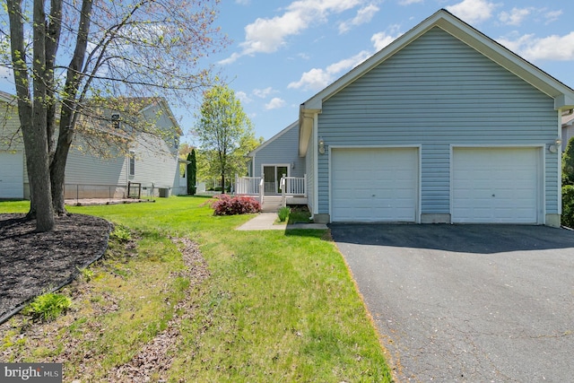 ranch-style home with a deck and a front yard