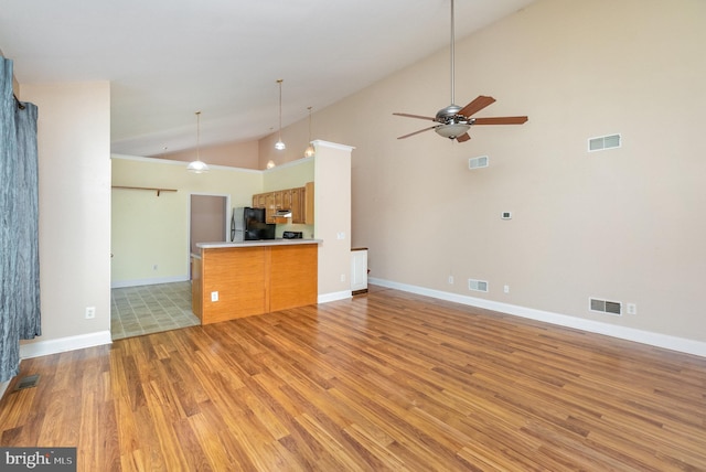 unfurnished living room with visible vents, light wood finished floors, and ceiling fan