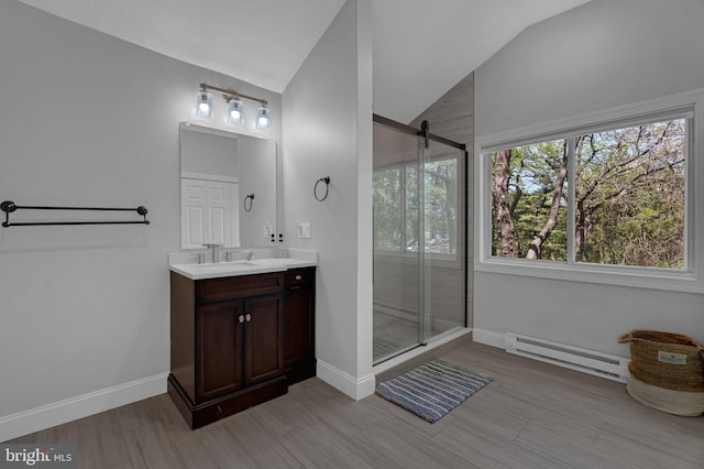 full bath with baseboards, a stall shower, a baseboard heating unit, and vaulted ceiling