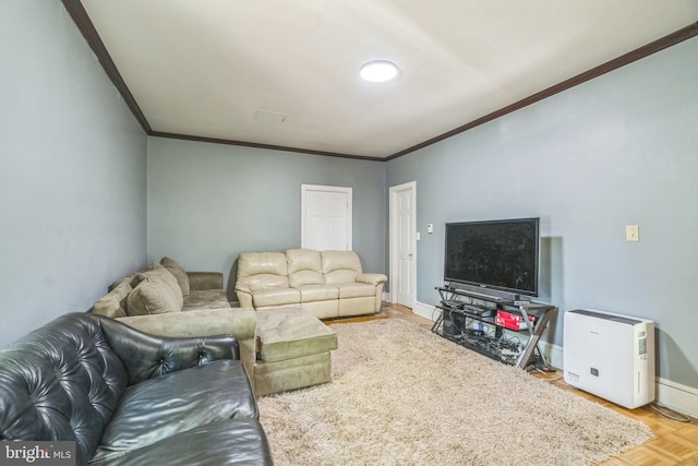 living area with baseboards and ornamental molding