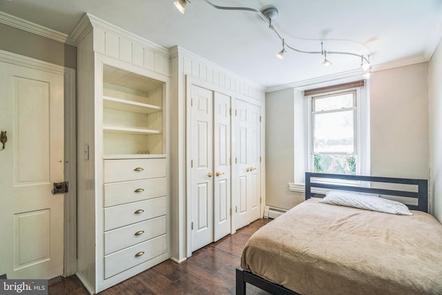 bedroom with dark wood-style flooring, ornamental molding, and a baseboard radiator
