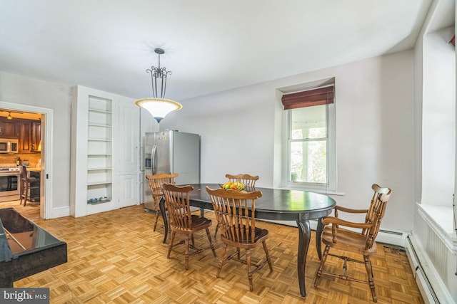 dining area featuring baseboard heating