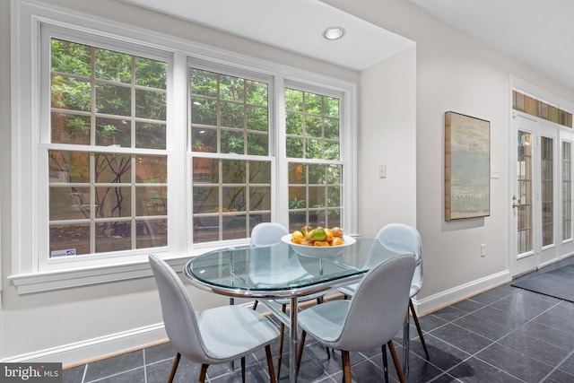 3929 Vacation Ln, Arlington, VA 22207 - dining space featuring dark tile patterned floors and baseboards