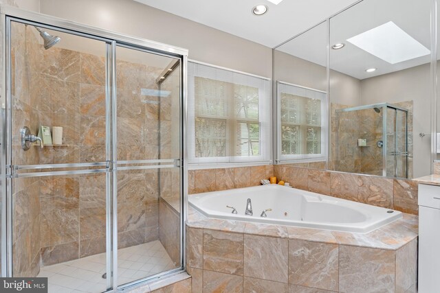 3929 Vacation Ln, Arlington, VA 22207 - full bathroom with a skylight, a jetted tub, a stall shower, and recessed lighting