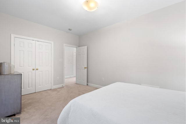 3929 Vacation Ln, Arlington, VA 22207 - bedroom featuring light colored carpet, a closet, and baseboards