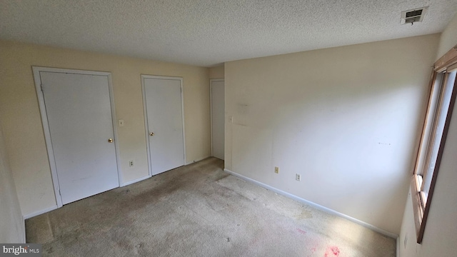 815 Ravens Crest Dr, Plainsboro, NJ 08536 - unfurnished bedroom featuring carpet floors, a textured ceiling, and baseboards