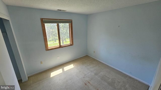 815 Ravens Crest Dr, Plainsboro, NJ 08536 - carpeted spare room with a textured ceiling and baseboards