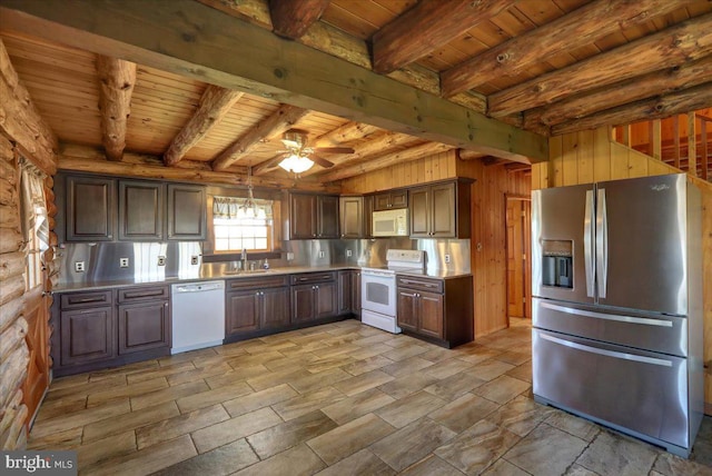kitchen with a sink, beamed ceiling, white appliances, and wooden ceiling