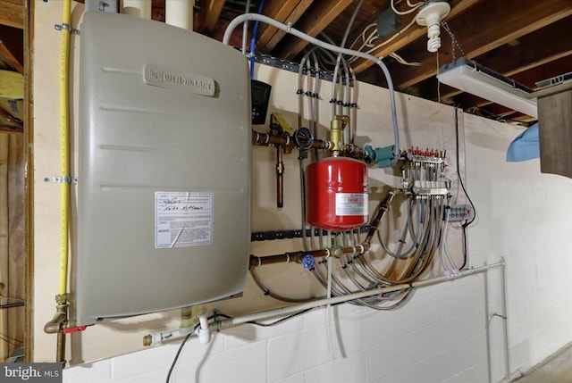 utility room featuring water heater