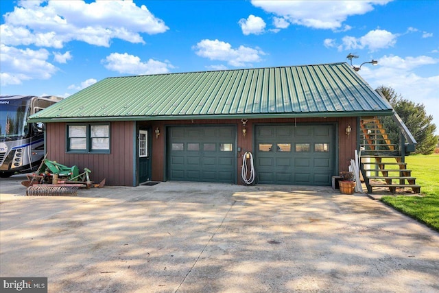garage with concrete driveway