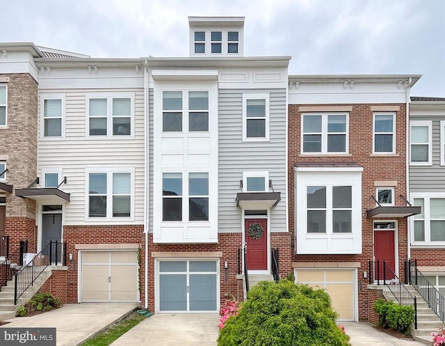 42667 New Dawn Ter, Brambleton, VA 20148 - multi unit property with brick siding, driveway, and an attached garage