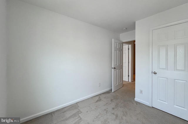42667 New Dawn Ter, Brambleton, VA 20148 - unfurnished bedroom featuring light colored carpet and baseboards