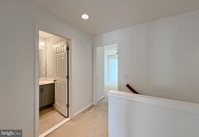 42667 New Dawn Ter, Brambleton, VA 20148 - hallway featuring light carpet, an upstairs landing, baseboards, and recessed lighting