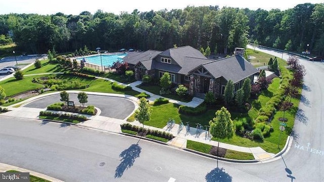 drone / aerial view with a wooded view