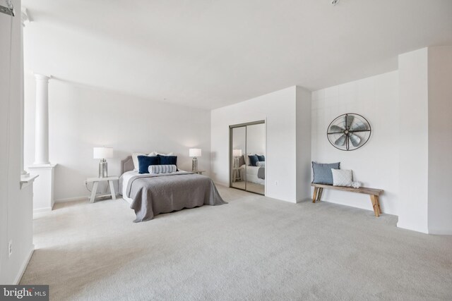 2608 Chapel Lake Dr Unit 312, Gambrills, MD 21054 - bedroom featuring decorative columns, carpet flooring, and a closet