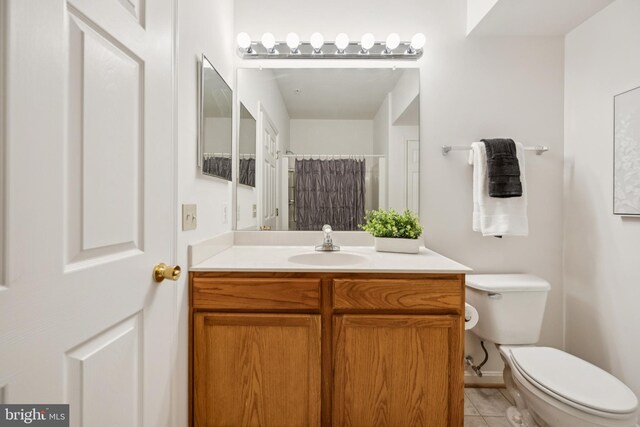 2608 Chapel Lake Dr Unit 312, Gambrills, MD 21054 - bathroom with vanity, toilet, curtained shower, tile patterned flooring, and baseboards
