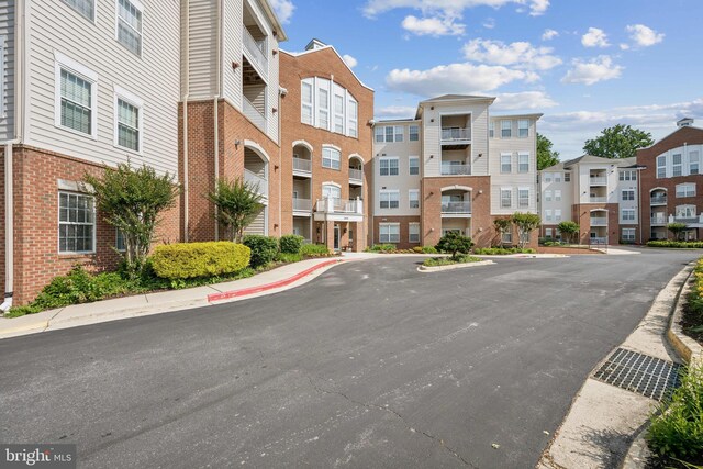 2608 Chapel Lake Dr Unit 312, Gambrills, MD 21054 - view of property with uncovered parking and a residential view
