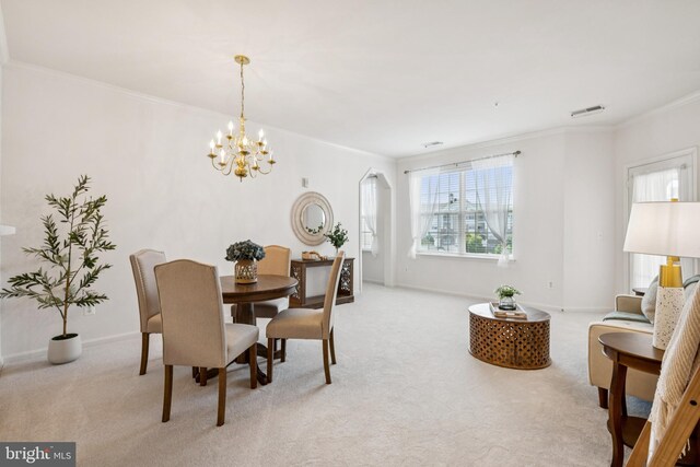 2608 Chapel Lake Dr Unit 312, Gambrills, MD 21054 - dining area featuring crown molding, light colored carpet, a chandelier, and baseboards