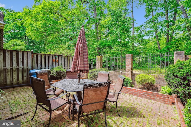 view of patio with a fenced backyard and outdoor dining space